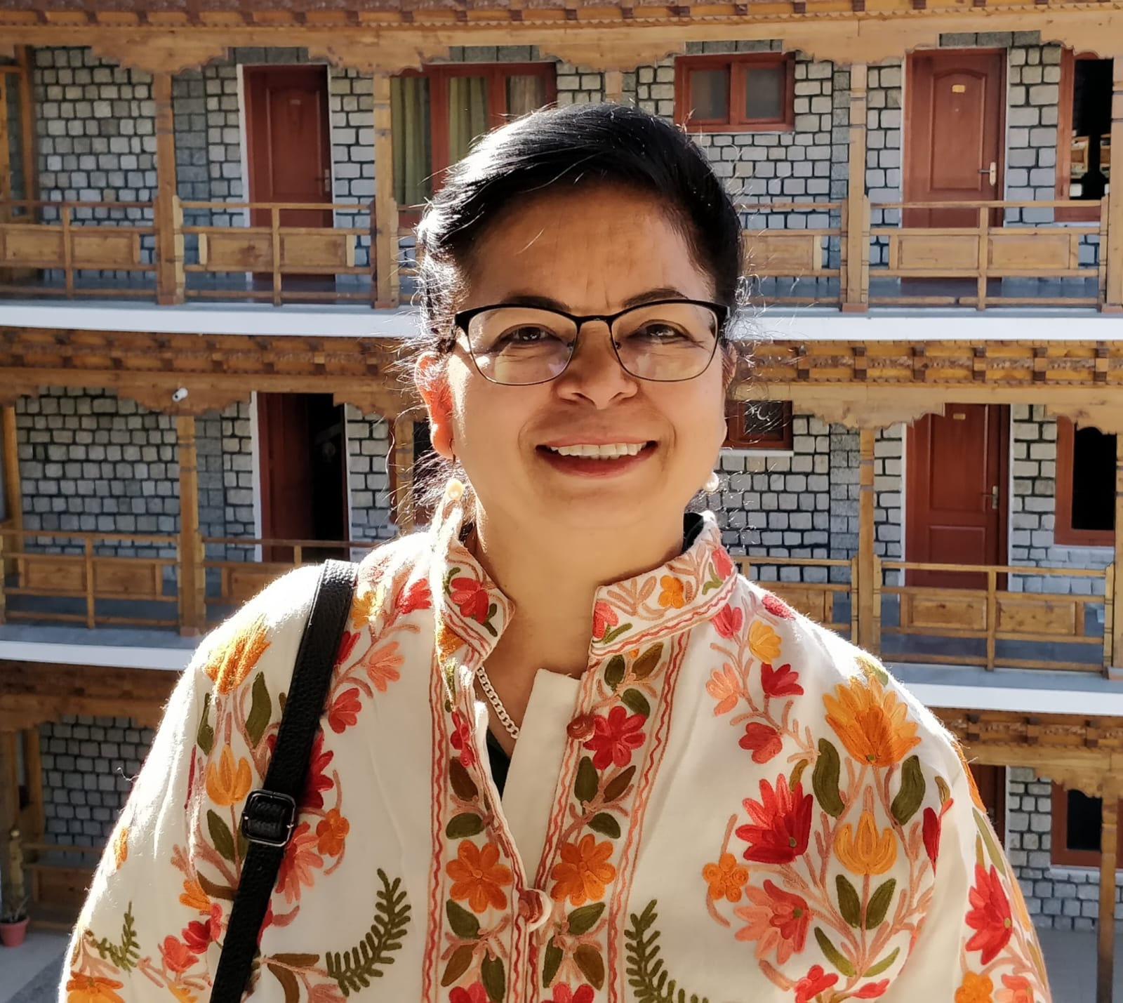 Malti Goyal, founder of Weneora, in a Himalayan tea garden at dawn